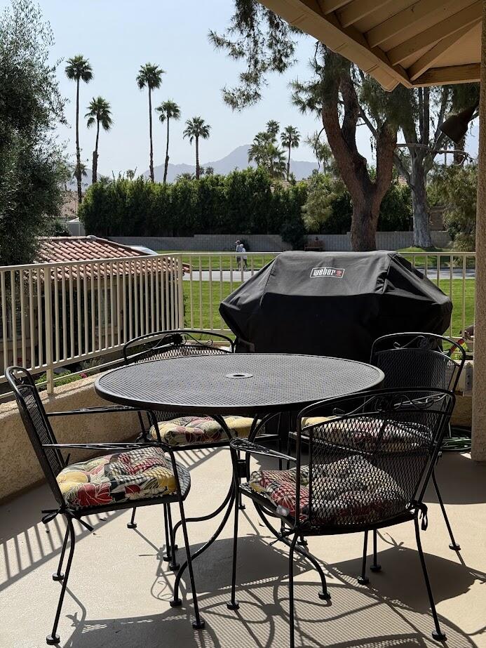 72822 Tony Trabert Lane Palm Desert, CA 92260 - Photo 6 of 23 a view of a chairs and table on the deck