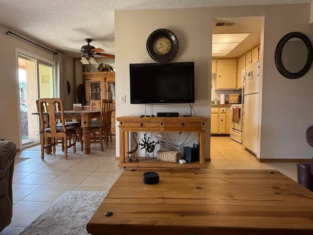 a living room with furniture and a lamp