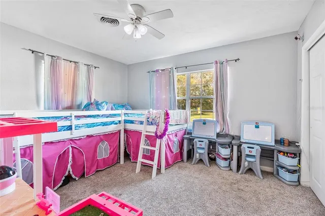 a bed room with a bed and a window