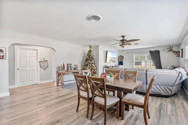 a dining room with furniture and window