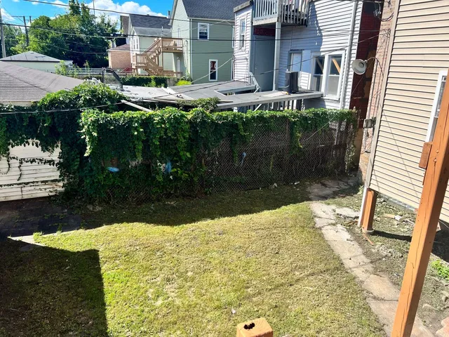 a view of backyard with patio