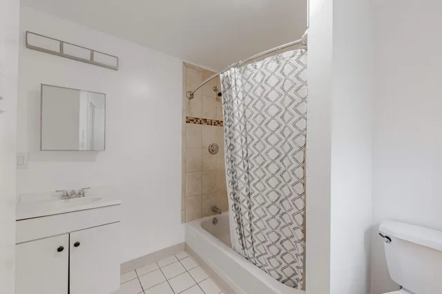 a bathroom with a bathtub and shower