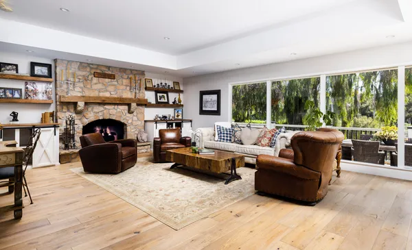 a living room with furniture and a fireplace