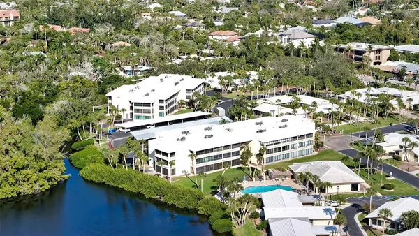 a kitchen with cabinets and window