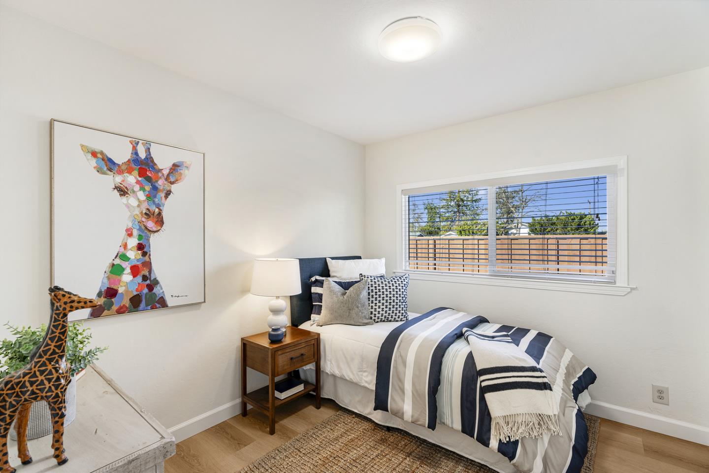 5601 Drysdale Drive San Jose, CA 95124 - Photo 13 of 26 a bedroom with a bed and a window