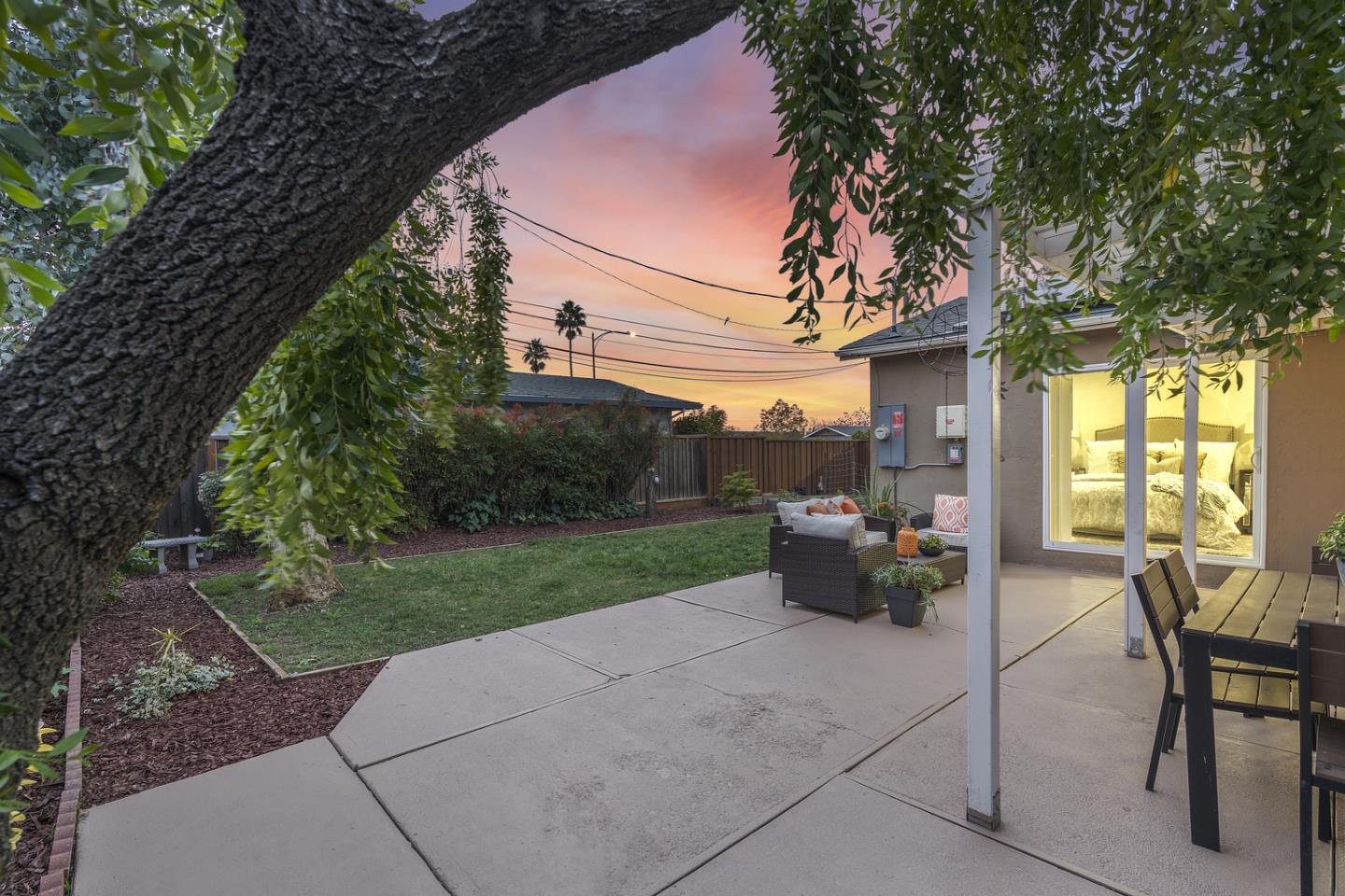5601 Drysdale Drive San Jose, CA 95124 - Photo 25 of 26 a view of a patio with table and chairs potted plants and large tree