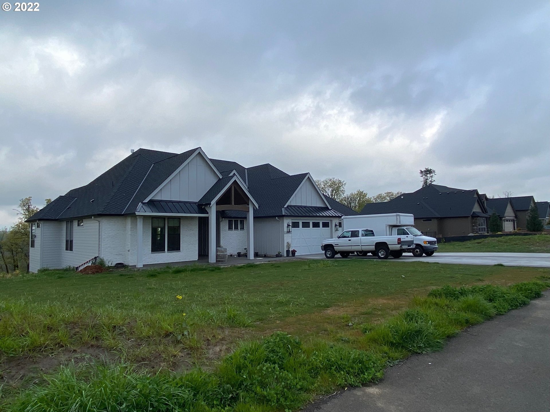 Northwest 72nd Court Ridgefield, WA 98642 - Photo 2 of 2 a view of a house with a big yard and large trees