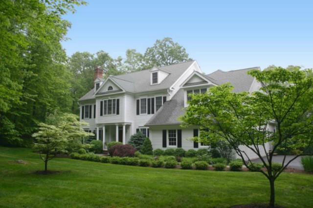 235 Old Branchville Road Ridgefield, CT 06877 - Photo 1 of 1 a front view of a house with a garden