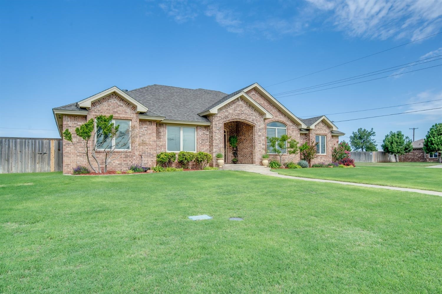 1921 Mesa Road Lubbock, TX 79403 - Photo 3 of 10 a front view of a house with a garden