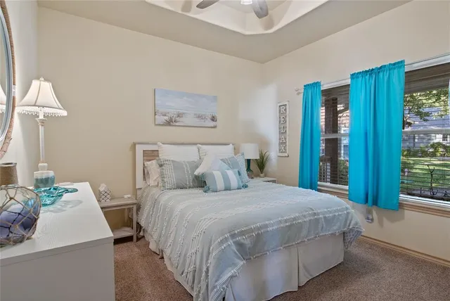 a bedroom with a large bed and a table