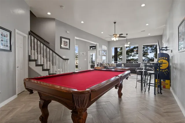 a room with furniture and pool table