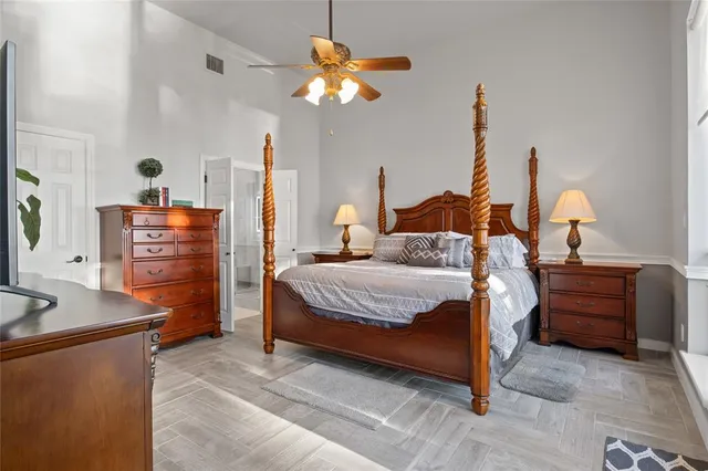 a bedroom with a bed and a dresser