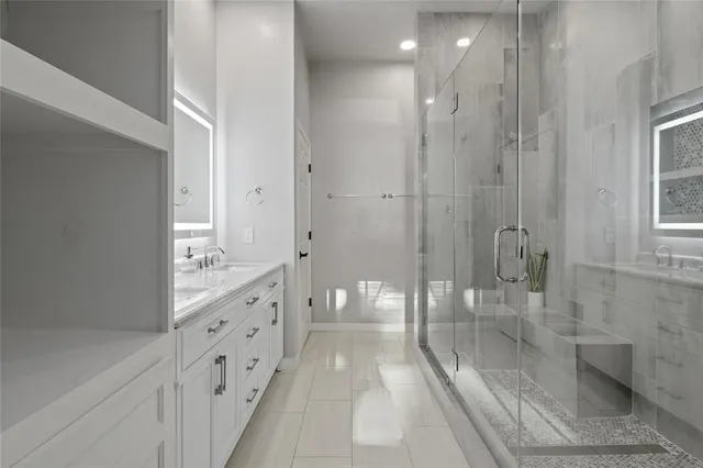 a bathroom with a glass door shower