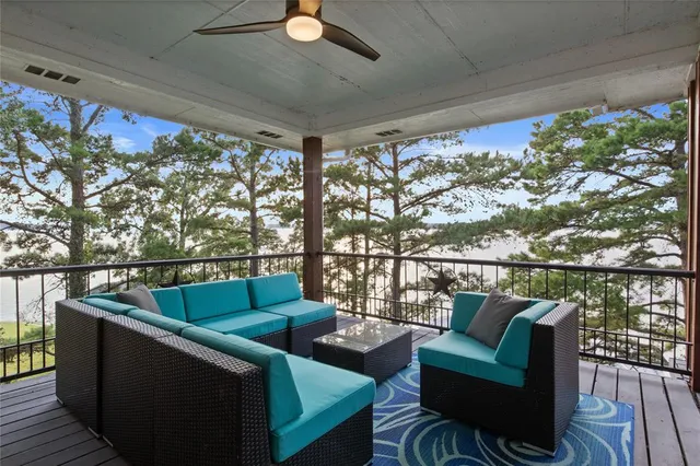 a view of a balcony with wooden floor