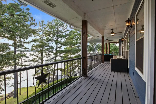 a view of balcony with wooden floor