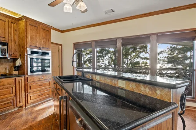 a view of a kitchen counter top and living room