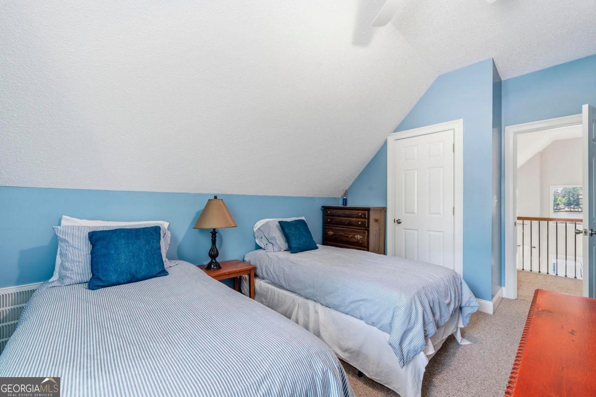 172 Mays Road Milledgeville, GA 31061 - Photo 39 of 54 a bedroom with two beds and a potted plant