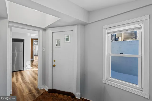 a view of an empty room with a window