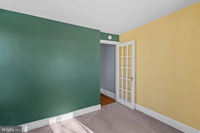 a view of a bathroom from a corridor