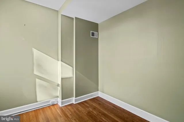 a view of front door with wooden floor