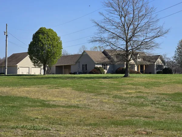 a house view with garden space