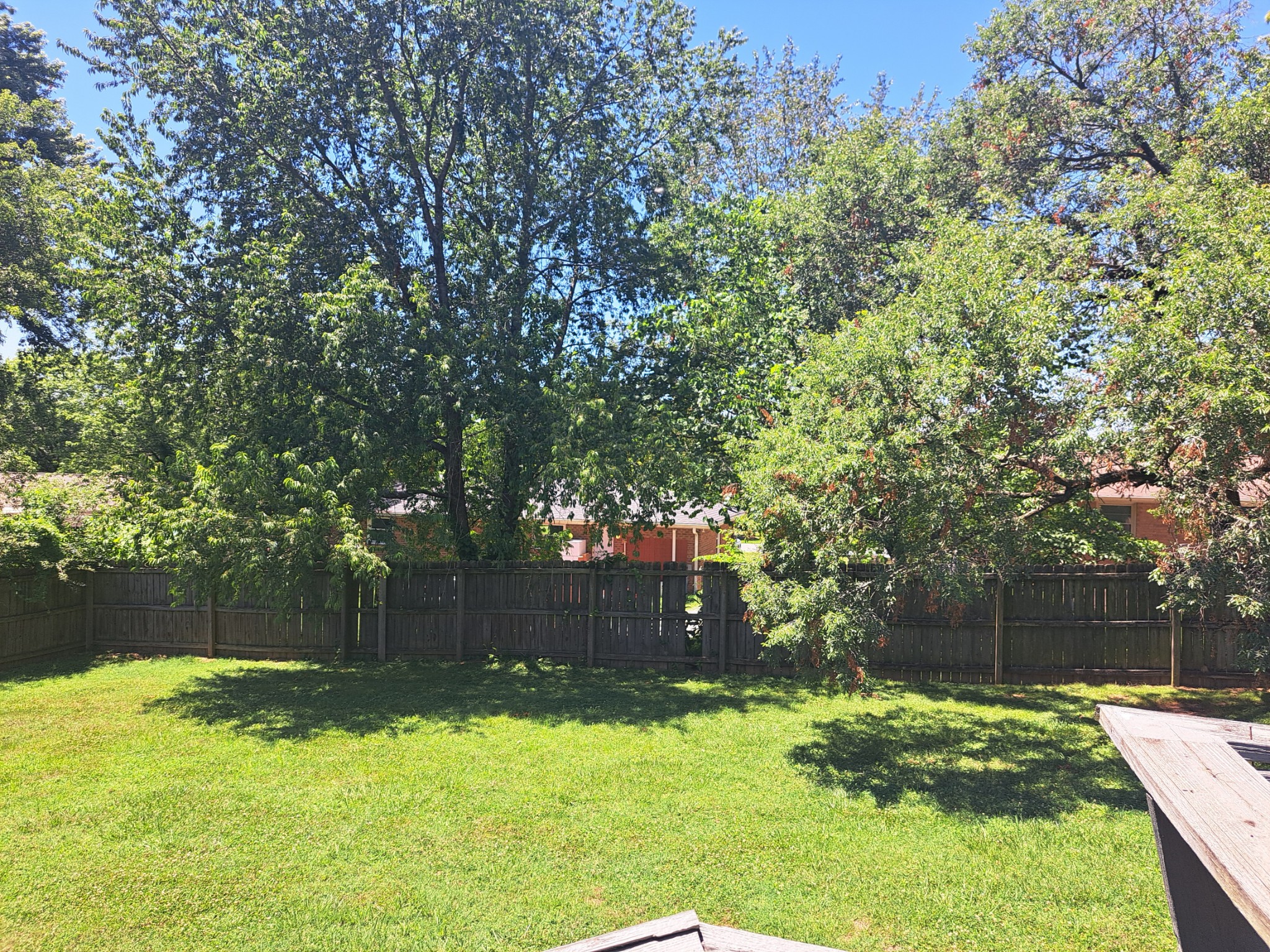 8317 Gordon Lane Hermitage, TN 37076 - Photo 7 of 23 a backyard of a house with yard and trampoline
