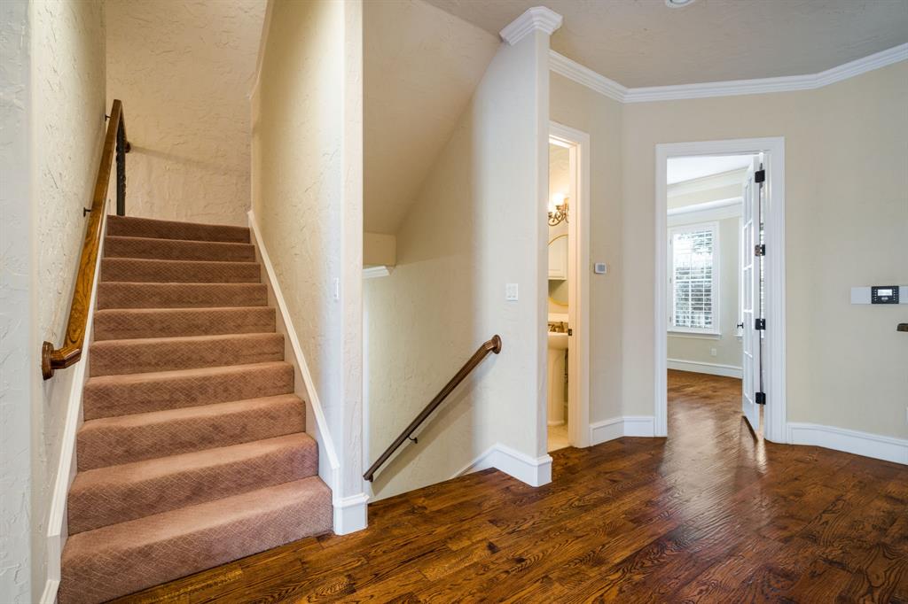 554 Rockingham Drive Irving, TX 75063 - Photo 11 of 34 a view of an entryway with wooden floor and staircase