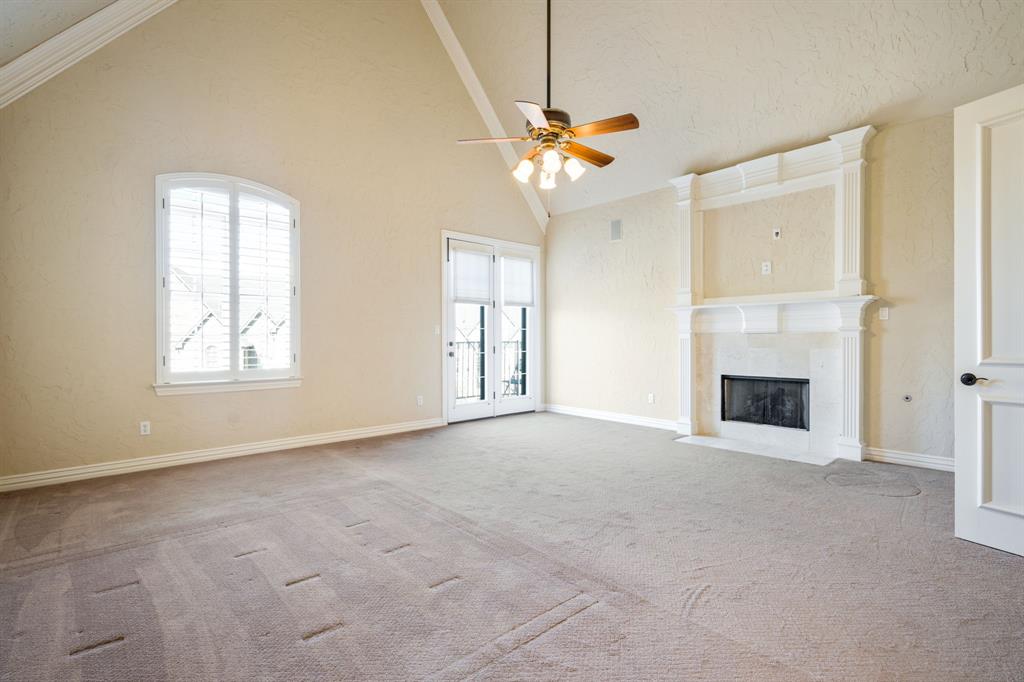 554 Rockingham Drive Irving, TX 75063 - Photo 19 of 34 a view of a livingroom with a fireplace and fan