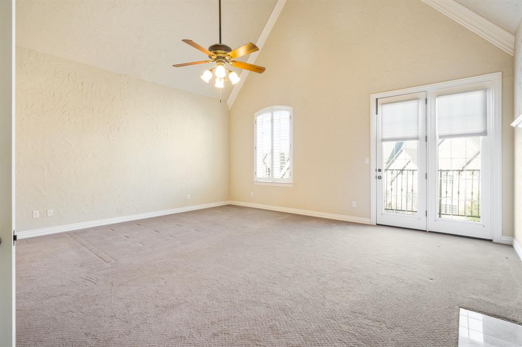 554 Rockingham Drive Irving, TX 75063 - Photo 21 of 34 an empty room with windows and chandelier fan