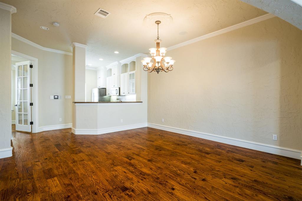 554 Rockingham Drive Irving, TX 75063 - Photo 9 of 34 a view of a kitchen with wooden floor and a kitchen