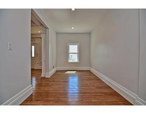 22 East Shore Road Holbrook, MA 02343 - Photo 12 of 27 a view of an empty room with wooden floor and a window