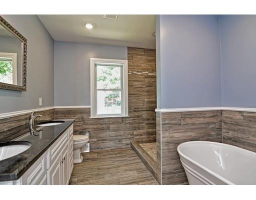 22 East Shore Road Holbrook, MA 02343 - Photo 15 of 27 a bathroom with a sink a bathtub a mirror and a window