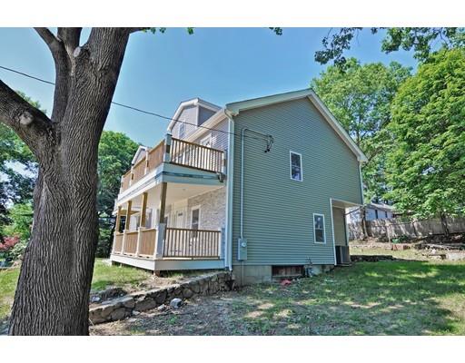22 East Shore Road Holbrook, MA 02343 - Photo 25 of 27 a view of a house with a small yard and wooden fence
