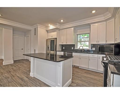 22 East Shore Road Holbrook, MA 02343 - Photo 6 of 27 a kitchen with stainless steel appliances granite countertop a sink and a stove