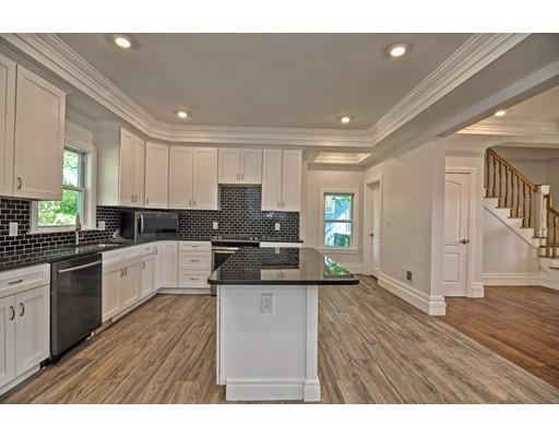 22 East Shore Road Holbrook, MA 02343 - Photo 7 of 27 a kitchen with granite countertop a sink cabinets and wooden floor