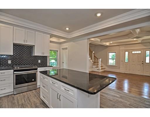 22 East Shore Road Holbrook, MA 02343 - Photo 8 of 27 a kitchen with granite countertop a sink a counter top space appliances and cabinets