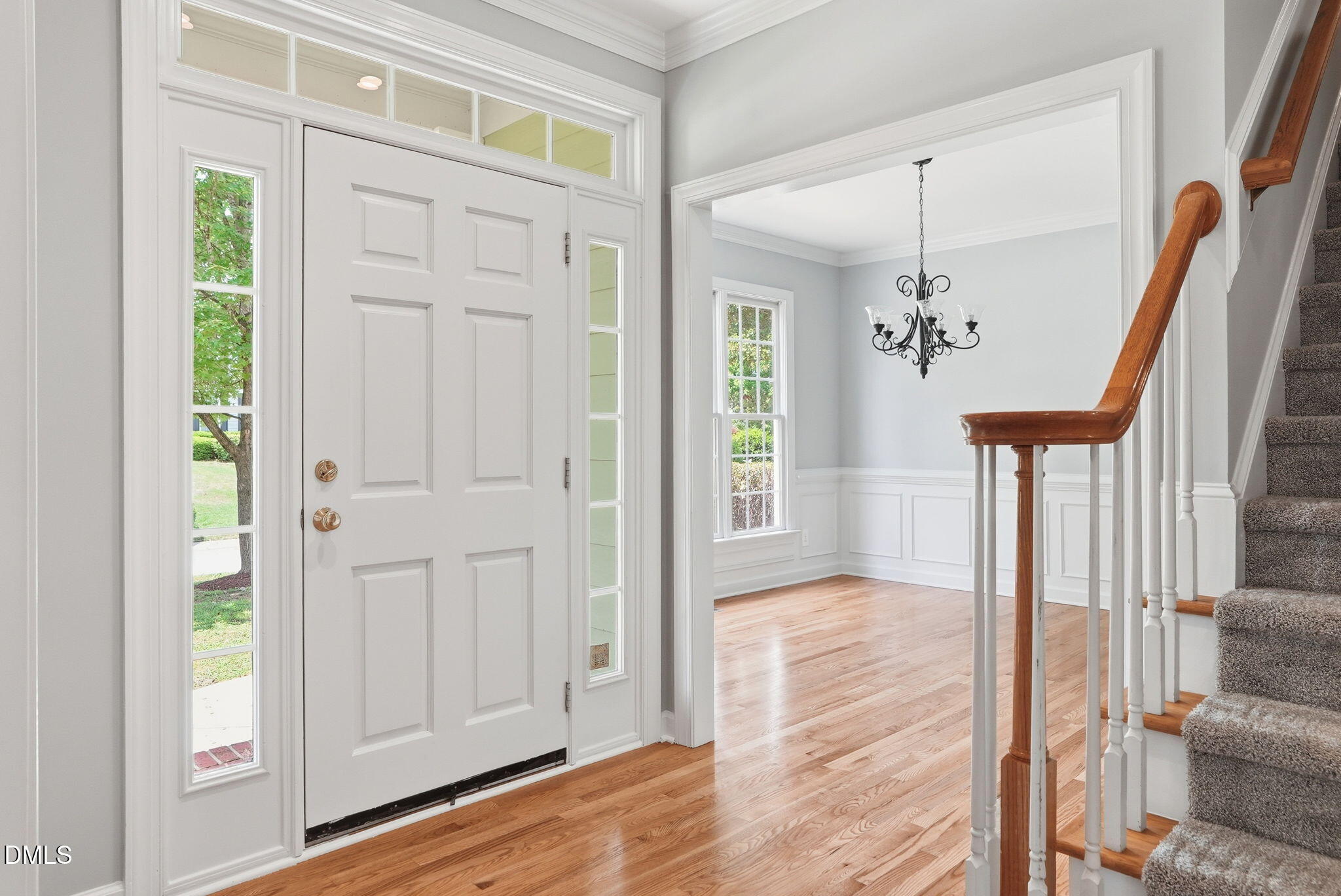 7 Morgans Ridge Lane Durham, NC 27707 - Photo 6 of 75 a view of a hallway with wooden floor and staircase