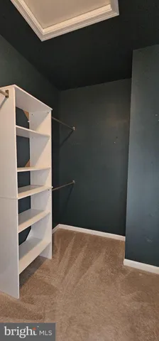 a bathroom with a granite countertop sink toilet and a mirror