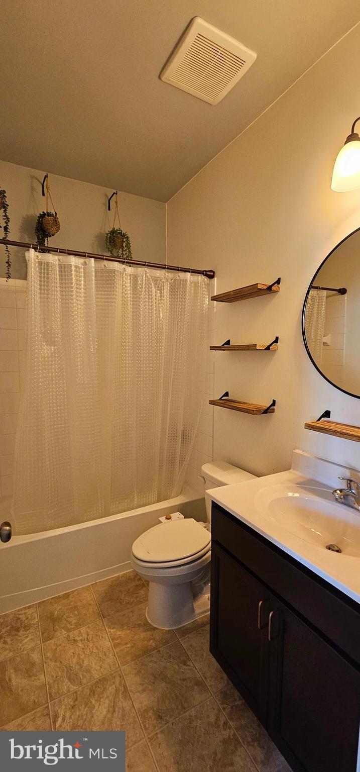 126 Lindy Way Stephenson, VA 22656 - Photo 12 of 22 a bathroom with a granite countertop sink toilet and a mirror