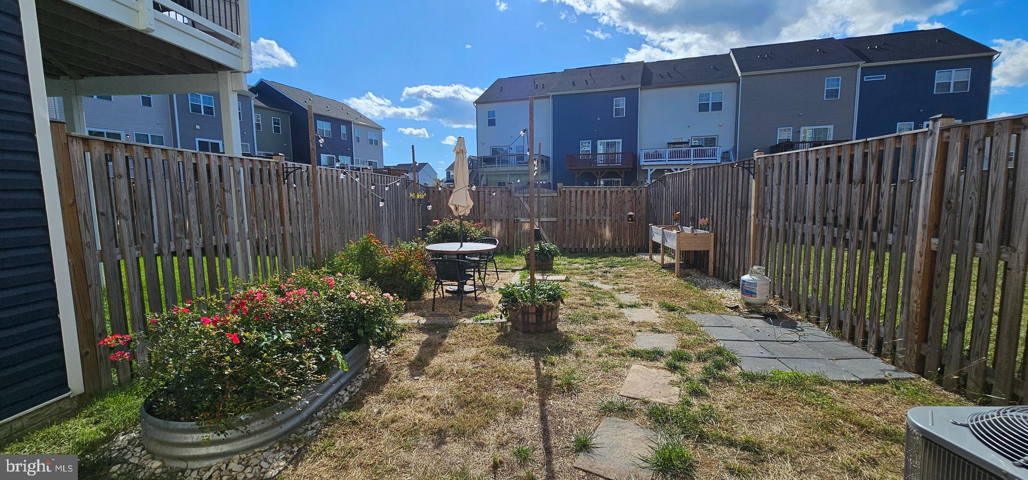 126 Lindy Way Stephenson, VA 22656 - Photo 21 of 22 a view of a backyard with potted plants