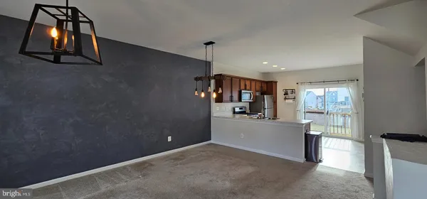 a view of a room with window and furniture