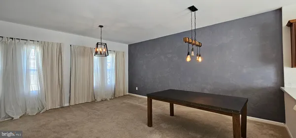 a view of room with a ceiling fan