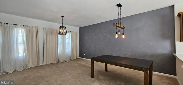 a view of room with a ceiling fan