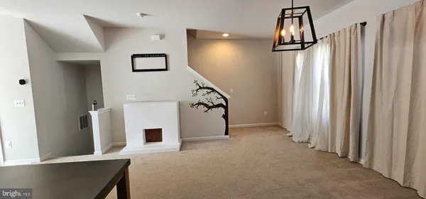 a bathroom with a granite countertop toilet and a sink