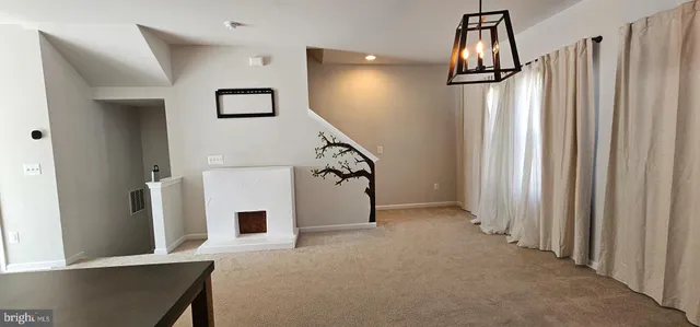 a bathroom with a granite countertop toilet and a sink