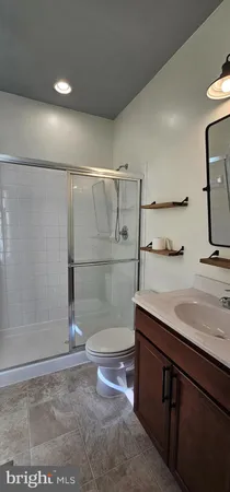 a bedroom with double bunk beds cabinets and a window