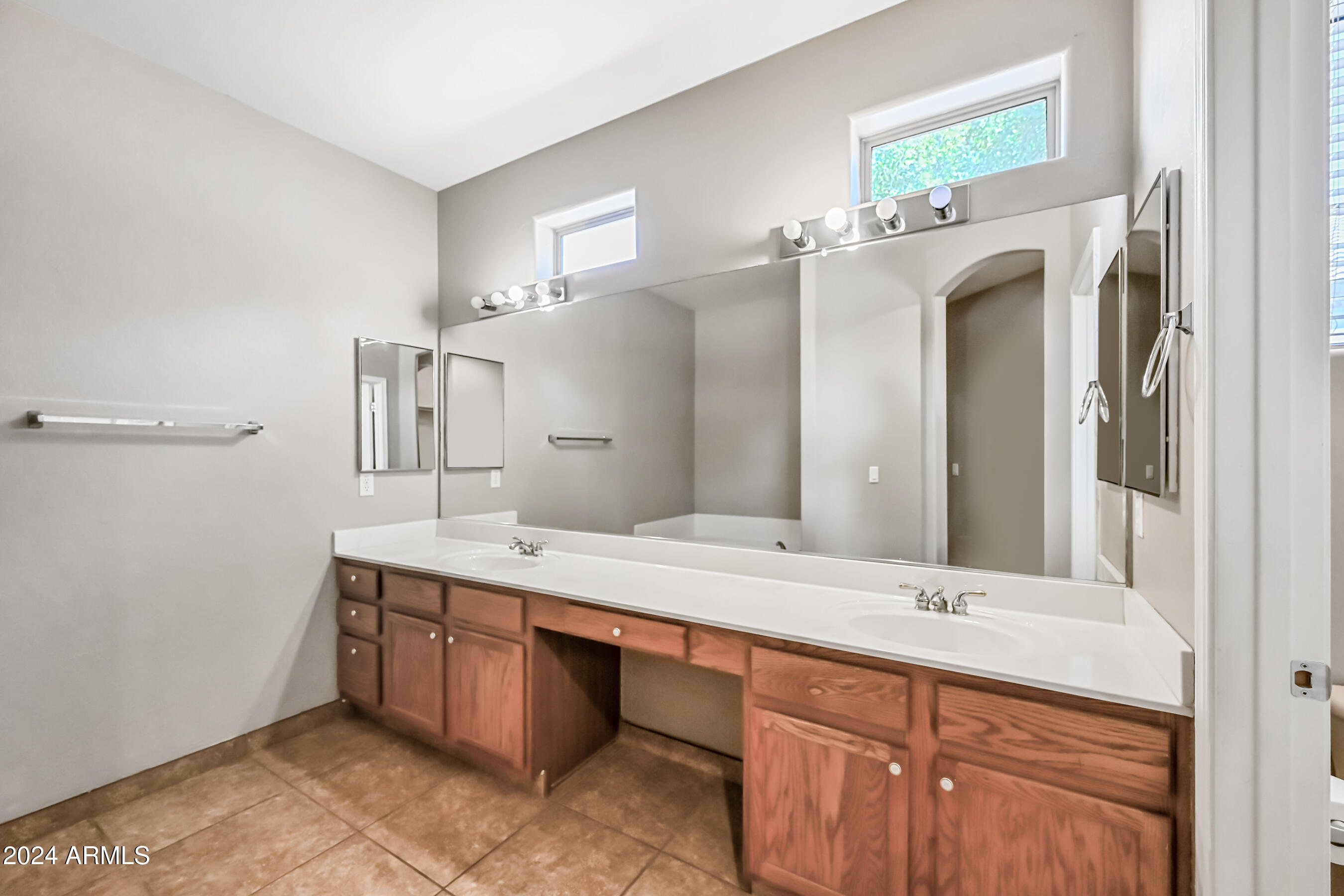 6707 East Roland Street Mesa, AZ 85215 - Photo 21 of 32 a bathroom with a sink double vanity and a mirror