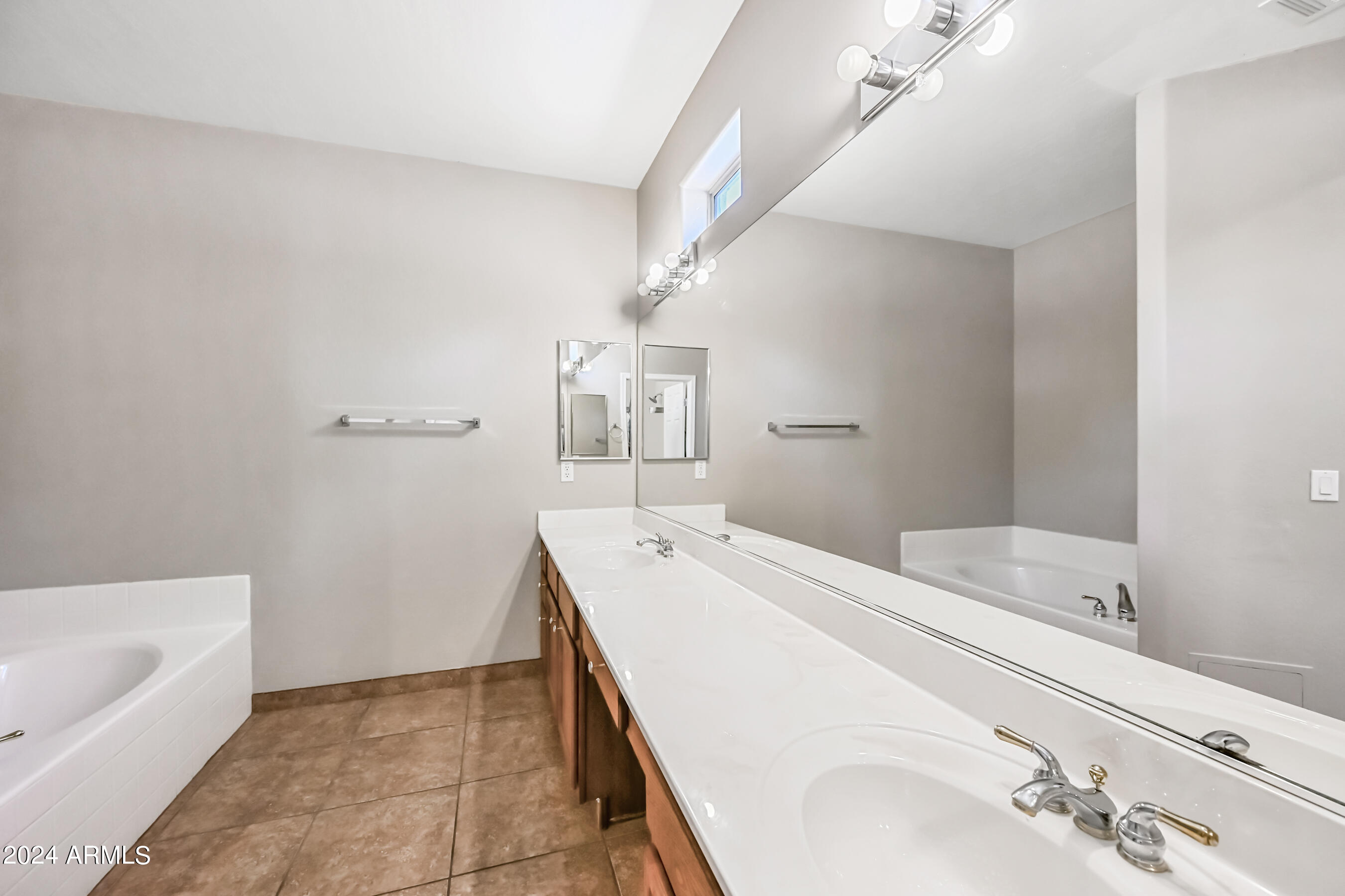 6707 East Roland Street Mesa, AZ 85215 - Photo 22 of 32 a bathroom with a sink and a bathtub