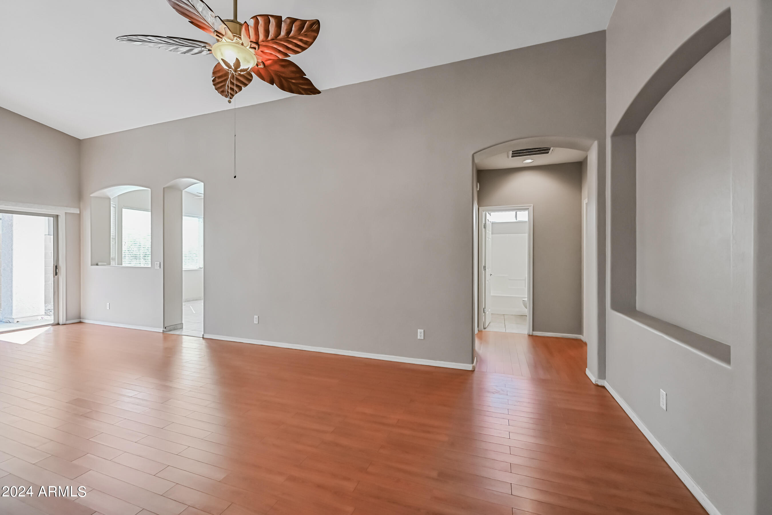 6707 East Roland Street Mesa, AZ 85215 - Photo 27 of 32 a view of an empty room with wooden floor
