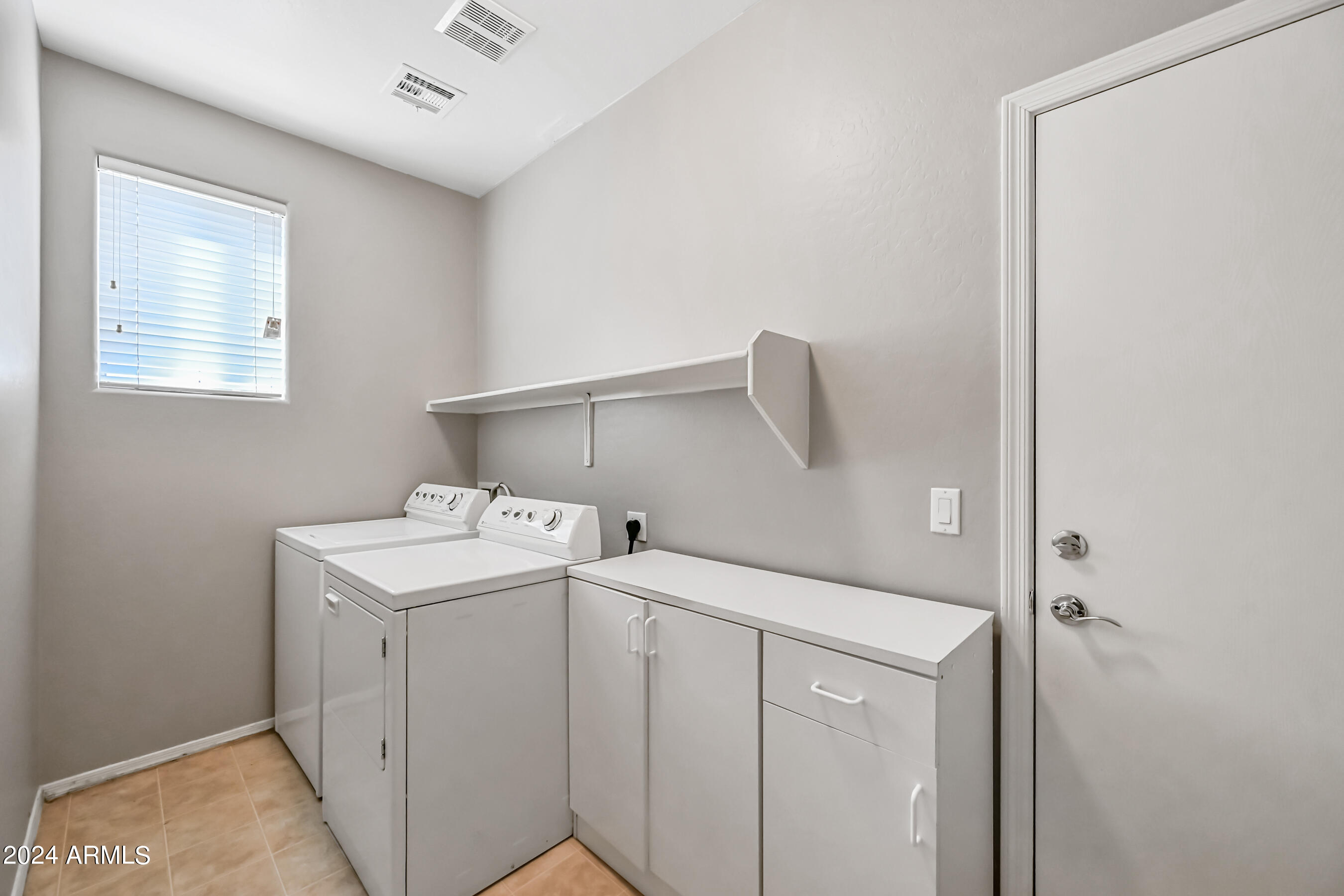 6707 East Roland Street Mesa, AZ 85215 - Photo 30 of 32 a utility room with dryer and washer